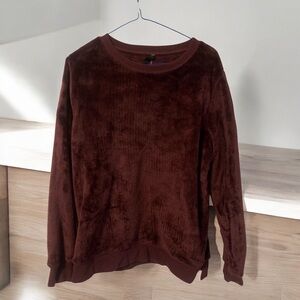 Woman’s super soft fuzzy purple sweater